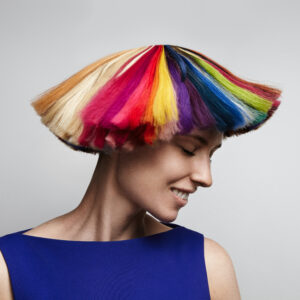 woman shake her rainbow color hair